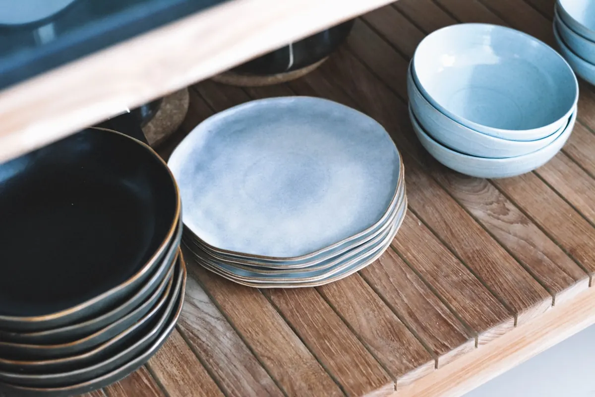 Handmade pottery on a studio shelf