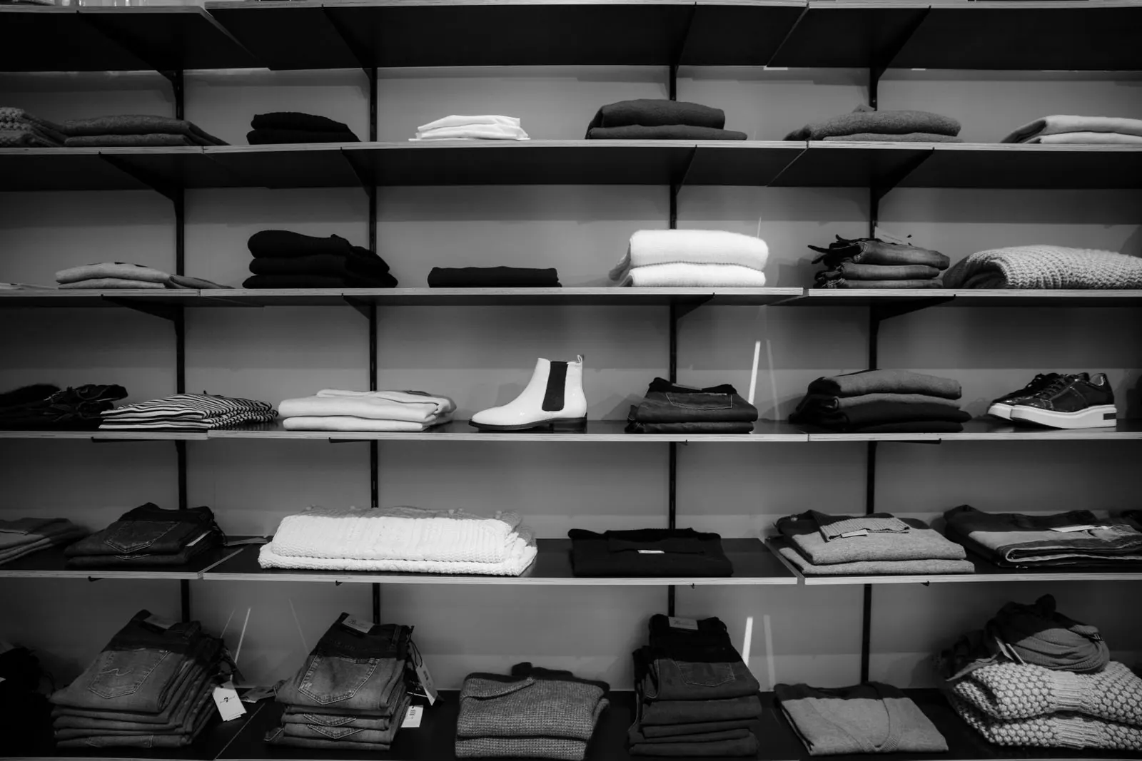 Shelves of folded linen and knitwear