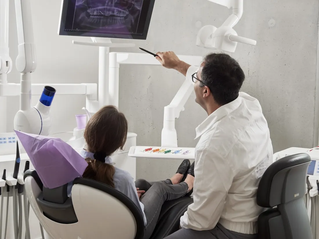 An orthodontic visit with a digital scan on screen